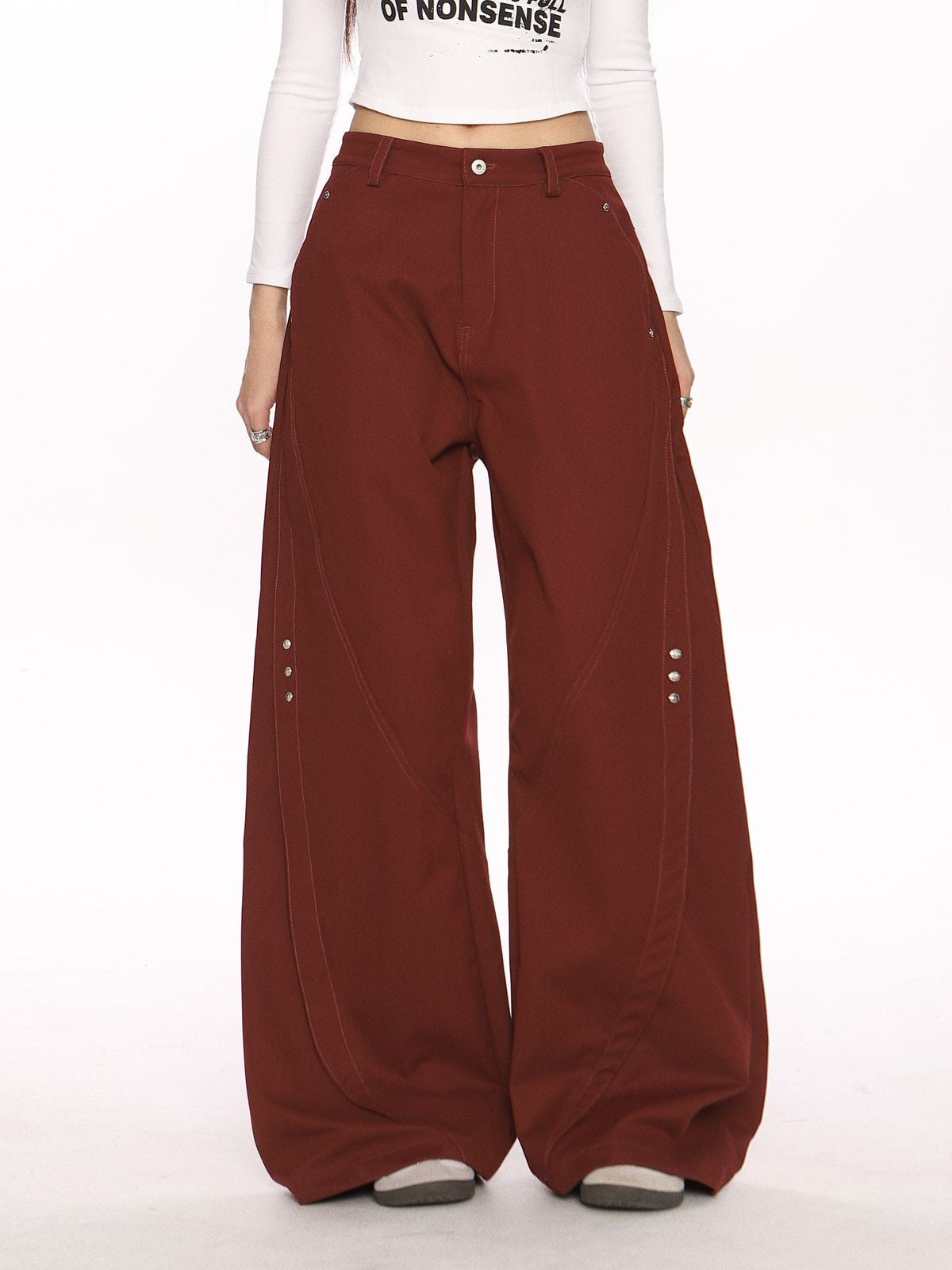 BIGGOLD STUDIO Deconstructed Curved Seam Trousers in Burgundy - On Model #color_burgundy