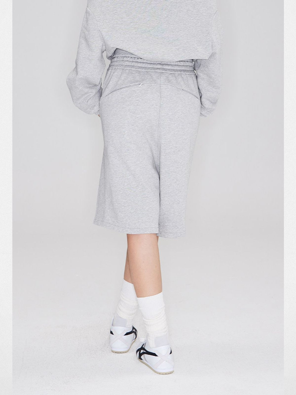 RARELY ALIKE Seamed Cotton Sweat Shorts in Gray - On Model