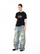 UNKNOWNWORLD Heavyweight Distressed Wide Leg Jeans in Blue - On Male Model