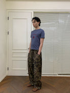 NeverSeez Quick Dry Wide Leg Trousers in Camouflage - On Male Model