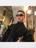 FUTURE UPDATE Sculptural Cat Eye Sunglasses in Black - On Male Model