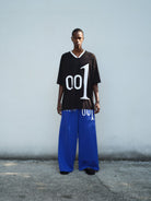 TRIANGLE PROJECT 001 Graphic V Neck Jersey Tee in Black - On Model