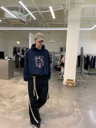 NeverSeez Layered Graphic Patch Hoodie in Navy - On Male Model