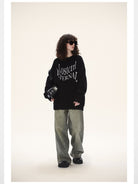 LOSTCTRL Distressed Logo Cotton Sweater in Black - On Female Model