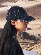 UNKNOWNWORLD Distressed Paint Splatter Cap in Black - On Model