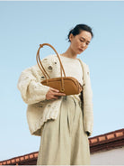 Songmont Small Nappa Leather Bowling Bag in Brown - On Model