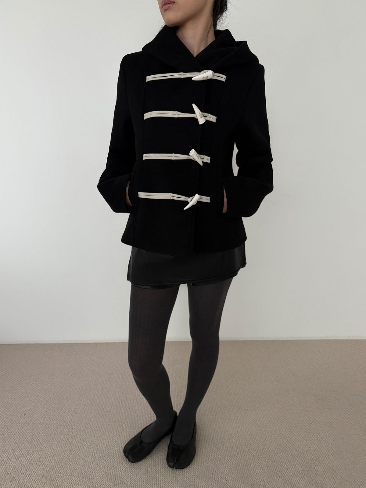 RARELY ALIKE Short Lambswool Duffle Coat in Black - On Model