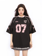 BIGGOLD STUDIO Raglan Sleeve V Neck Jersey in Black - On Model #color_black