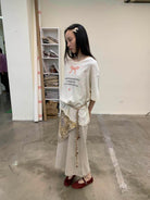 NeverSeez Snake Bow Print T Shirt in White - On Model