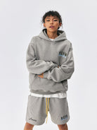MEDM Embroidered Logo Fleece Hoodie in Gray - On Model