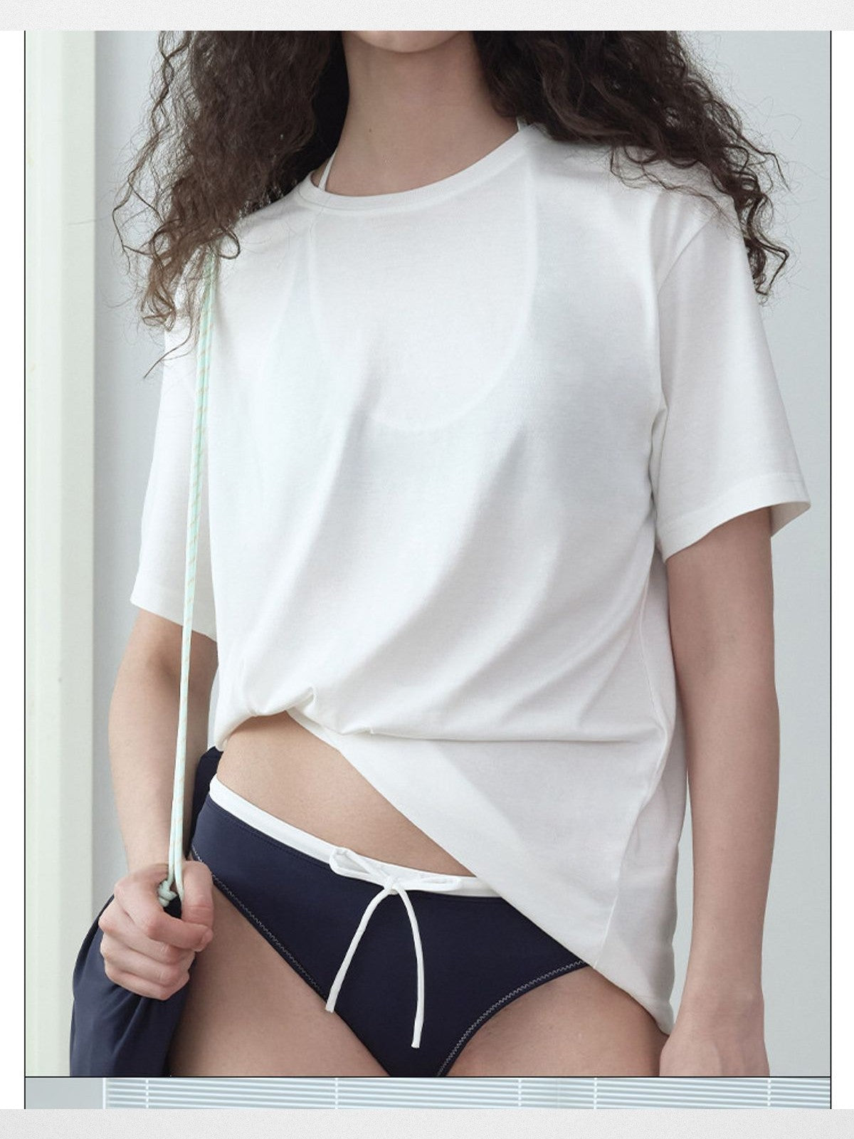RARELY ALIKE Twisted Hem Cotton Silk Blend Tee in White - On Model