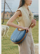 Songmont Denim Leather Crescent Bag in Blue - On Model