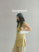 Songmont Mini Leather Bowling Bag in Cream - On Model