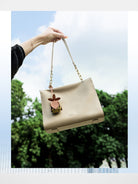 HONGU Leather Chain Strap Shoulder Bag in Beige - On Female Model