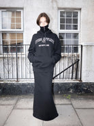 RARELY ALIKE Living Offline Embroidered Fleece Hoodie in Black - On Model