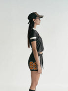 BADSEED Cropped Graphic Baseball Jersey in Black - On Model