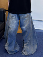 Triangle Project Distressed Dirty Dye Patchwork Jeans in Denim - On Male Model