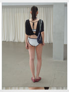 RARELY ALIKE Tie Back Lyocell Batwing Top in Black - On Model