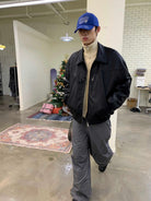 NeverSeez Leather Down Puffer Jacket in Black - On Male Model