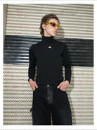 TRIANGLE PROJECT Logo High Neck Long Sleeve Top in Black - On Model