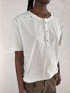 UNKNOWNWORLD Distressed Cotton Henley T Shirt in White - On Model