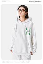 MEDM Embroidered Logo Hoodie in White - On Female Model