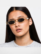 FUTURE UPDATE Sculptural Cat Eye Sunglasses in Brown - On Female Model