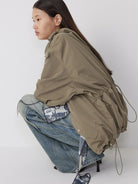RandomPiece Stowable Hood Triacetate Jacket in Olive - On Model