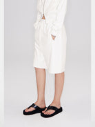 RARELY ALIKE Seamed Cotton Sweat Shorts in White - On Model