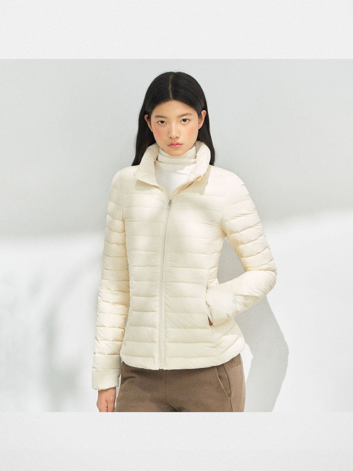 ARISEISM Lightweight Stand Collar Down Puffer in Cream - On Model