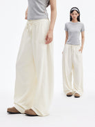 MEDM Cooling Wide Leg Track Pants in White - On Female Model