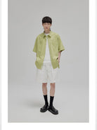 NANS Sand Washed Cotton Curved Hem Shirt in Green - On Model