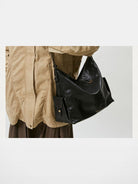 Songmont Large Suede Travel Hobo in Black - On Model