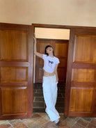 NeverSeez Lace Bow Graphic Baby Tee in White - On Model