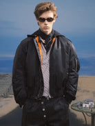 SOD Online Store Narcoleptic Hooded Bomber Jacket in Black - On Model