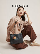 HONGU Leather Chain Strap Shoulder Bag in Black - On Female Model