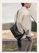 Songmont Vegetable Tanned Leather Hobo in Black - On Model