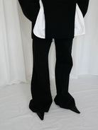 RARELY ALIKE Flared Cotton Denim Jeans in Black - On Model