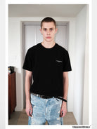 UNKNOWNWORLD Small Logo Cotton T Shirt in Black - On Model